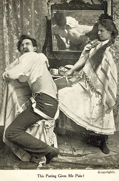 Woman kicking her husband (b  /  w photo)