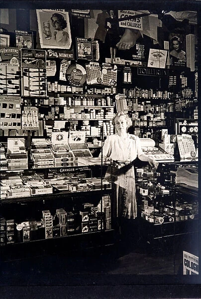 Woman shopkeeper in a tobbaconists (b  /  w photo)