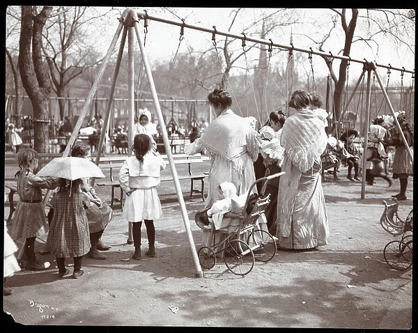Women and children at the swings on Arbor Day, Tompkins Square Park, New York