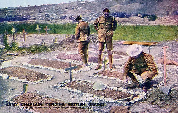World War 1: British army chaplain tending to graves