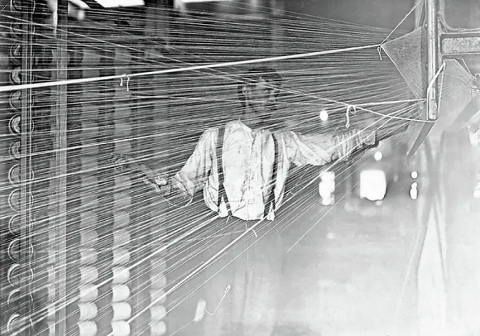 Framed Print : A wrapper working at his machine, 1908 Framed Print : A wrapper working at his machine, 1908