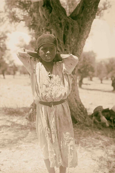 Young girl standing front tree 1898 Middle East