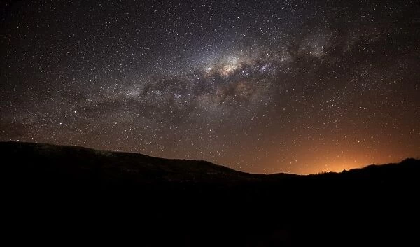 The Milky Way setting behind the hills of Azul, Argentina