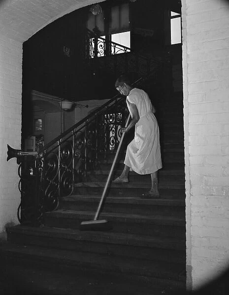 Government charwoman cleaning after regular working hours, Washington, D. C. 1942. Creator: Gordon Parks