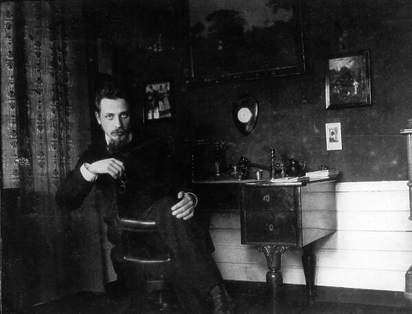 Rainer Maria Rilke in his study, c. 1905. Creator: Anonymous