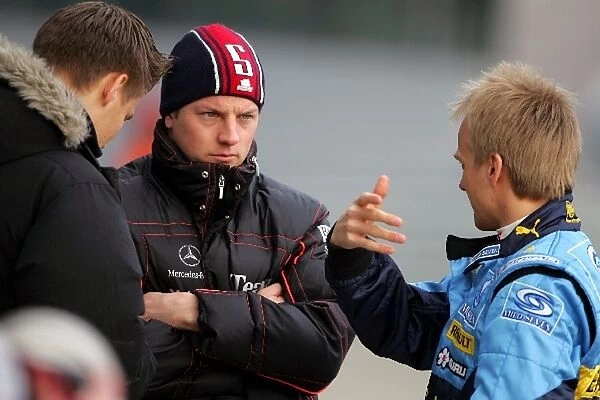 Formula One Testing: Toni Vilander, Kimi Raikkonen McLaren and Heikki Kovalainen Renault Test Driver talk in the pitlane