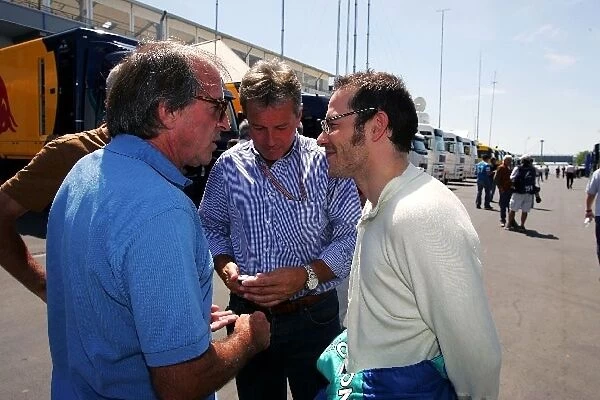 Formula One World Championship: Jacques Laffite talks with Craig Pollock Driver Manager and Jacques Villeneuve Sauber