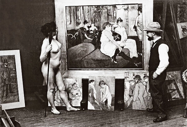 Toulouse-Lautrec and naked model in his studio standing in front of his 1893 painting Au Salon de la rue des Moulins. Henri Marie Raymond Toulouse-Lautrec, aka Henri de Toulouse-Lautrec, 1864-1901. French Post-Impressionist artist, printmaker, draughtsman, caricaturist, and illustrator. Photograph by Maurice Guibert, 1856-1913