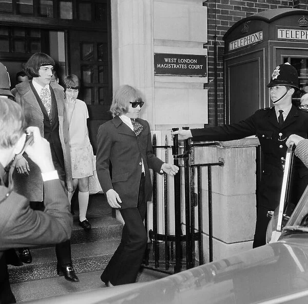 Brian Jones of The Rolling Stones leaving court with Prince Stanislaus Klossowski de Rola