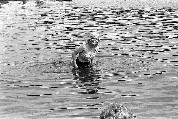 A concert goer cools of in the serpentine during the free Rolling Stones concert in Hyde