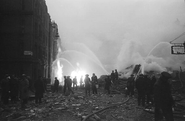 Firemen at work on Ebury Street, Pimlico. 16th April 1941