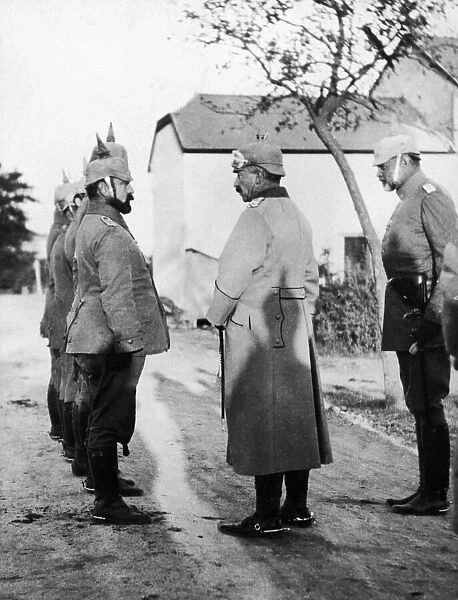 Kaiser Wilhelm II seen here inspecting a group of army doctors in a village close to