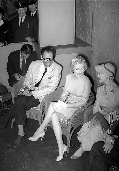 Marilyn Monroe with her new husband Arthur Miller and actress Vivien Leigh at a press