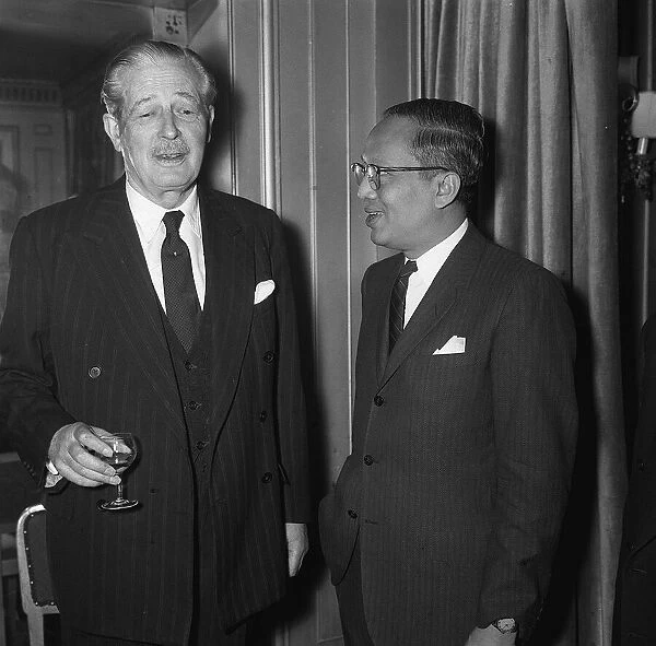 The Prime Minister Harold Macmillan talking to colleagues at the United Nations