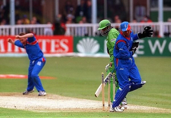 Robert Croft England May 1999 celebrates after Aplesh Vadher is bowled with Alec