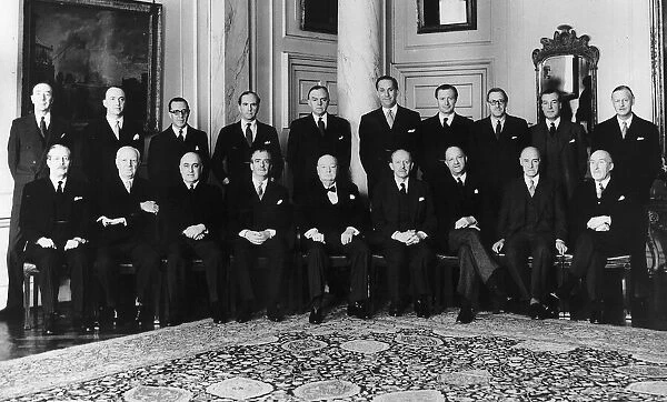 Sir Winston Churchill sits with his cabinet before announcing his retirement