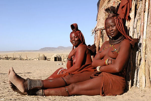 Namibia. Himba women, Himba village near Purros, Kaokoland, Kunene Region, Namibia
