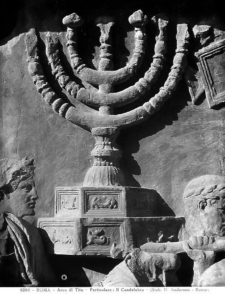 Detail of the bas-reliefs of the Arch of Titus, Rome, depicting the candelabrum with seven arms, carried on the shoulders by two men with a laurel wreath