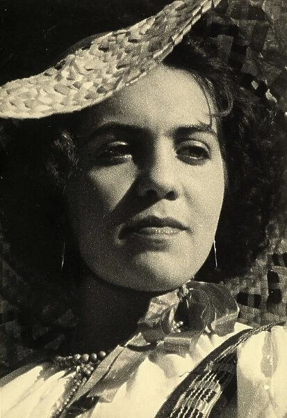 Close-up of a woman in traditional costume. Postcard sent by the author to Vincenzo Balocchi