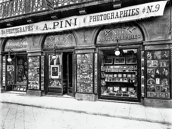 Shop windows of 'A. Pini' photographic reproductions located on Lungarno, Florence