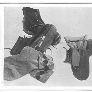 An array of walking boots, knitted socks and waterproof mittens, from Gamages Date: 1930