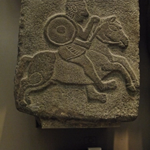 Black basalt relief depicting a soldier on a horse. Syria