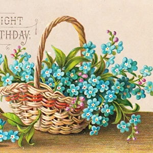 Blue flowers in a basket on a birthday card