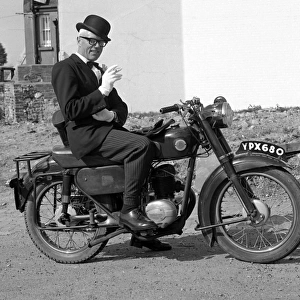Well dressed man on a motorcycle