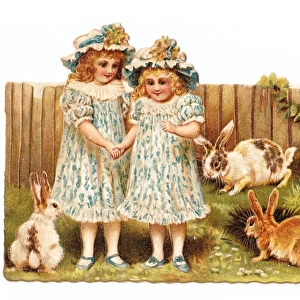Two girls in a garden on a cutout greetings card