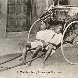 Mozambique - Maputo - Two Rickshaw Boys take a nap