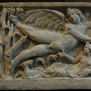 Roman Art. Marble sarcophagus with flying erotes holding a c