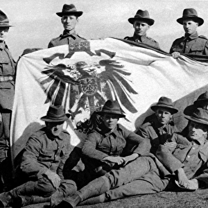 Soldiers from the New Zealand Expeditionary Force posed with the captured Imperial German Standard