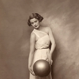 Stylish girl posing with ball