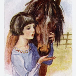 Young girl petting pony