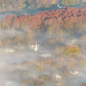 USA, Tennessee. Church steeple rises above fog. Date: 10-12-2020