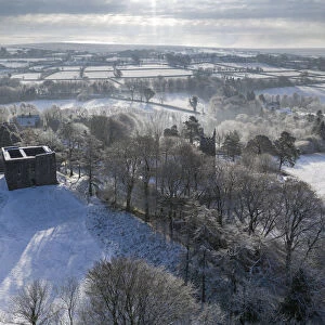 Aerial view of Lydford Castle on a snowy winter morning, Lydford, Devon, England