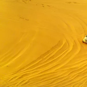 Desert safari adventure in 4x4 vehicle bashing side to side through the desert dunes