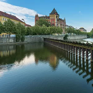 Historic Bellevue building and wooden icebreaker on Vltava River, Prague, Bohemia, Czech Republic (Czechia), Europe