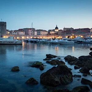 The lights of old town Dubrovnik and its harbour during blue hour, Dubrovnik, Croatia
