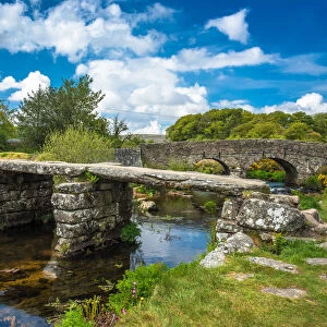 Medieval clapper bridge over the East Dart River at Postbridge on Dartmoor in Devon