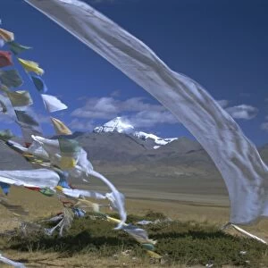Prayer flags on top of low pass on Barga Plain, with Mount Kailas (Kailash) beyond
