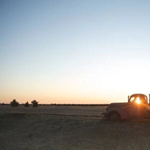 The sun beams through window of old farm truck at sunrise, Shaniko, California, United States of America, North America