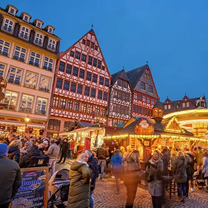 View of carousel and Christmas Market on Roemerberg Square at dusk, Frankfurt am Main, Hesse, Germany, Europe