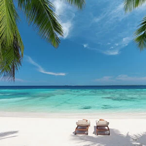 Wooden lounge chairs on a beautiful tropical beach, The Maldives, Indian Ocean, Asia