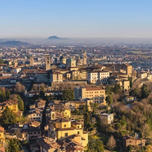 Bergamo, Lombardy, Italy. High angle view over Upper Town (Citta Alta) at sunset