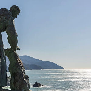 Europe, Italy, Liguria. Monterosso statue of Saint Francis overlooking the sea