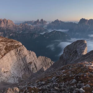 Europe, Italy, Veneto, Cadore, Auronzo. Sunrise with sea of clouds from Camosci peak