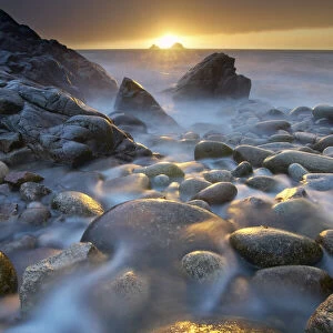 Porth Nanven pebble beach at sunset, St Just, Cornwall, England