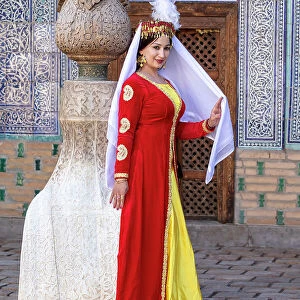 Uzbekistan, Khiva, , Harem of the Tash Kauli complex, an Uzbek performer dressed in traditional costume