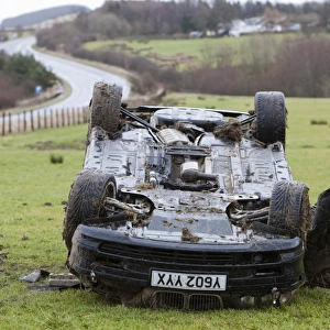 A BMW car crashed on its roof in the middle of a field after leaving the road at high speed on the A66 near Keswick Cumbria